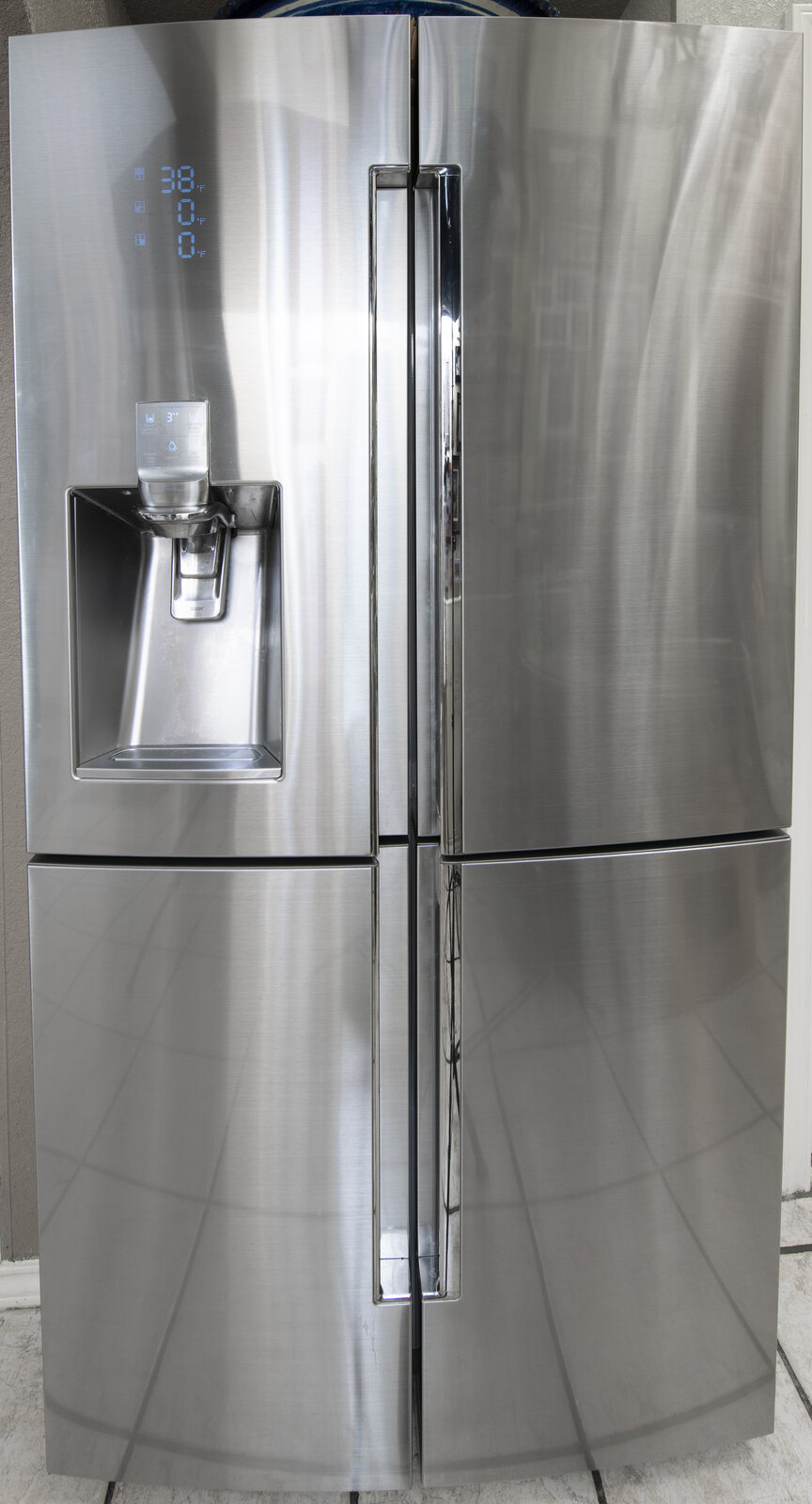 A real refrigerator display showing 38 degrees Fahrenheit and freezer displays showing 0 degrees Fahrenheit