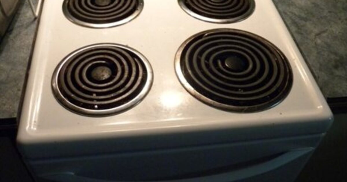 A real freestanding electric range with four coil elements and an oven