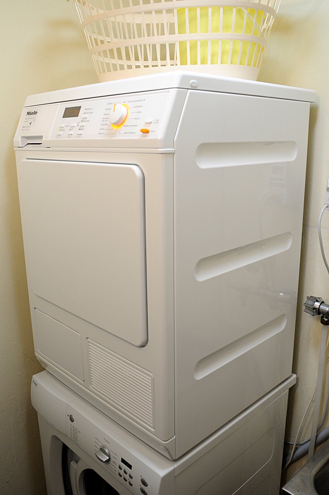 A real heat-pump clothes dryer in a laundry area