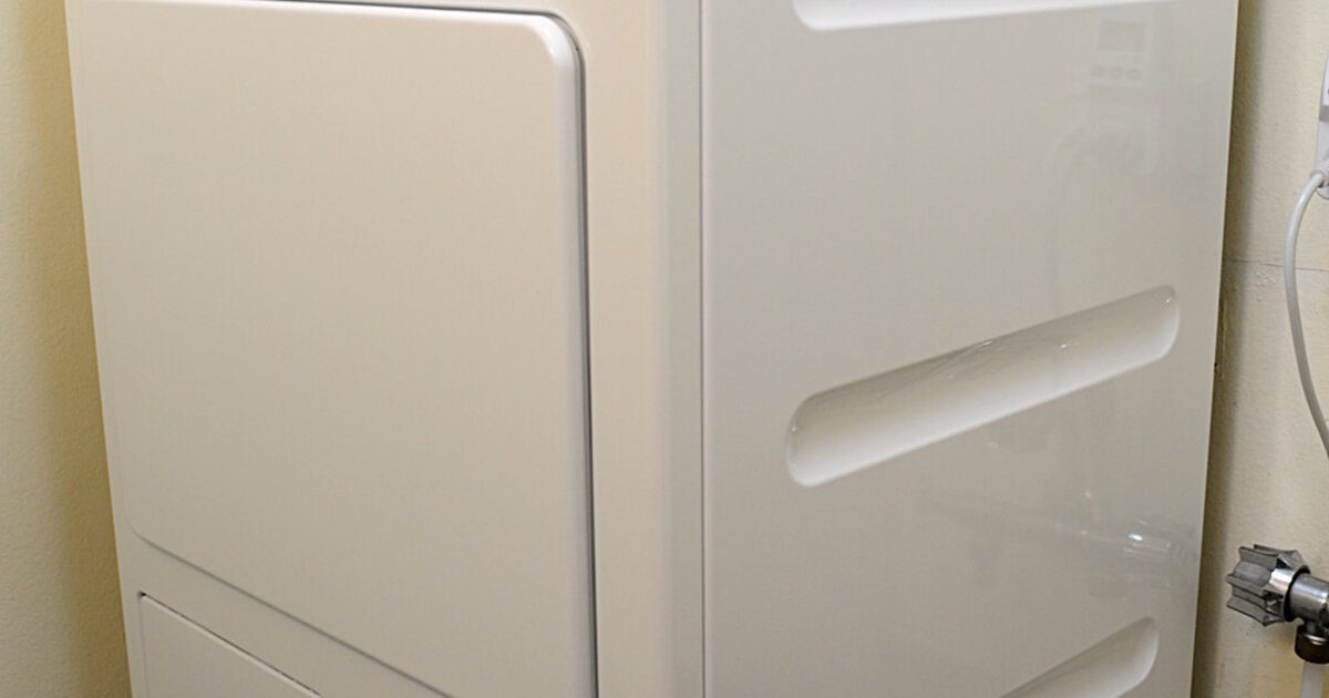 A real heat-pump clothes dryer in a laundry area