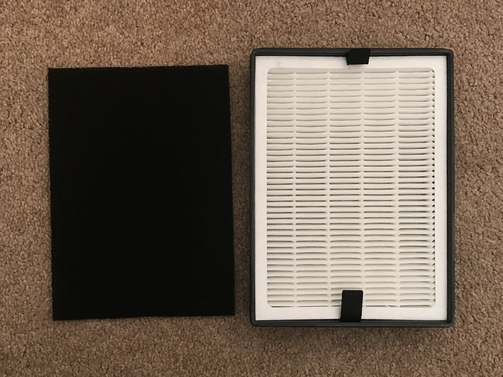A real rectangular HEPA filter beside a real activated-carbon filter