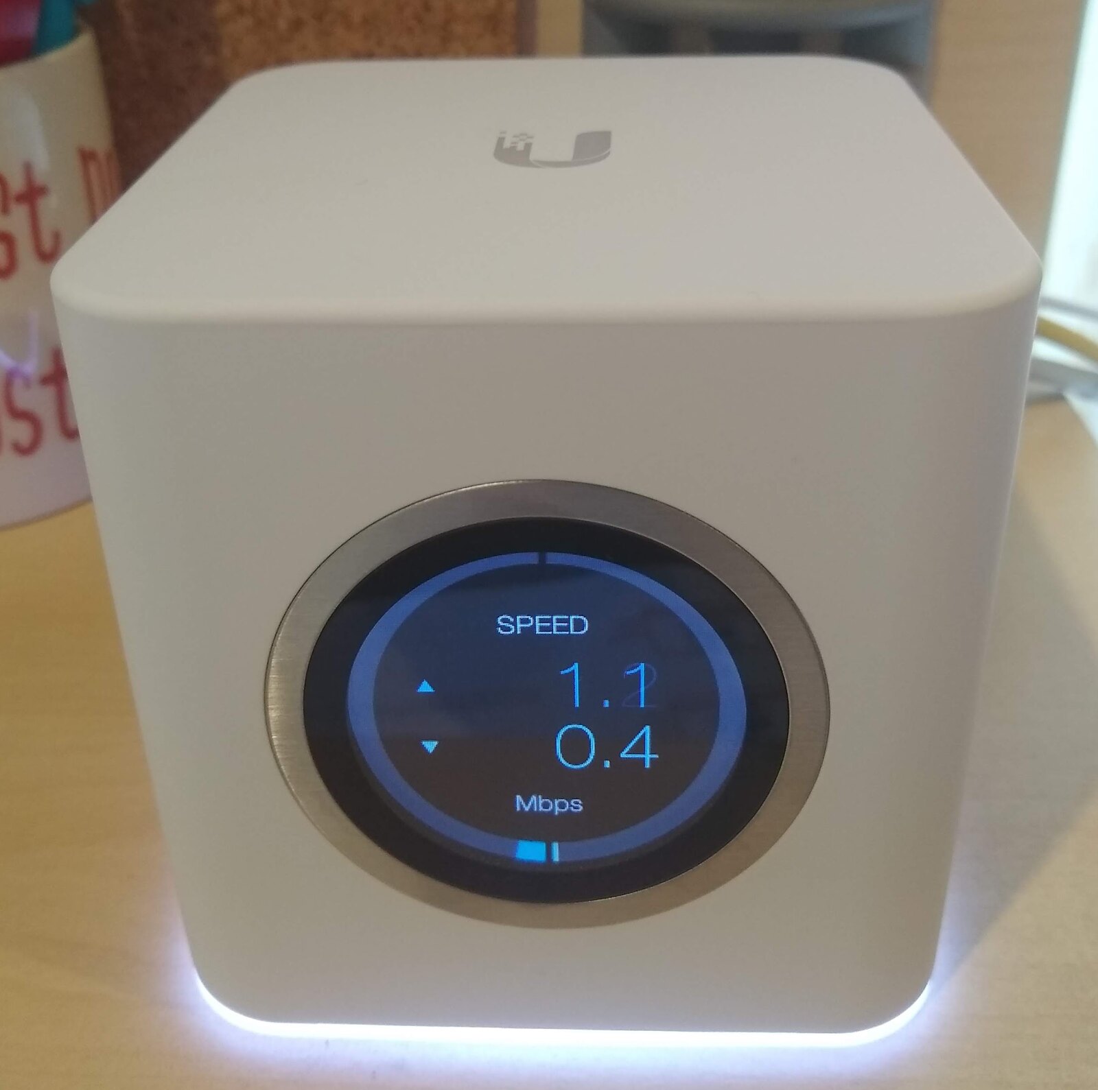 A real white mesh Wi-Fi node on a table