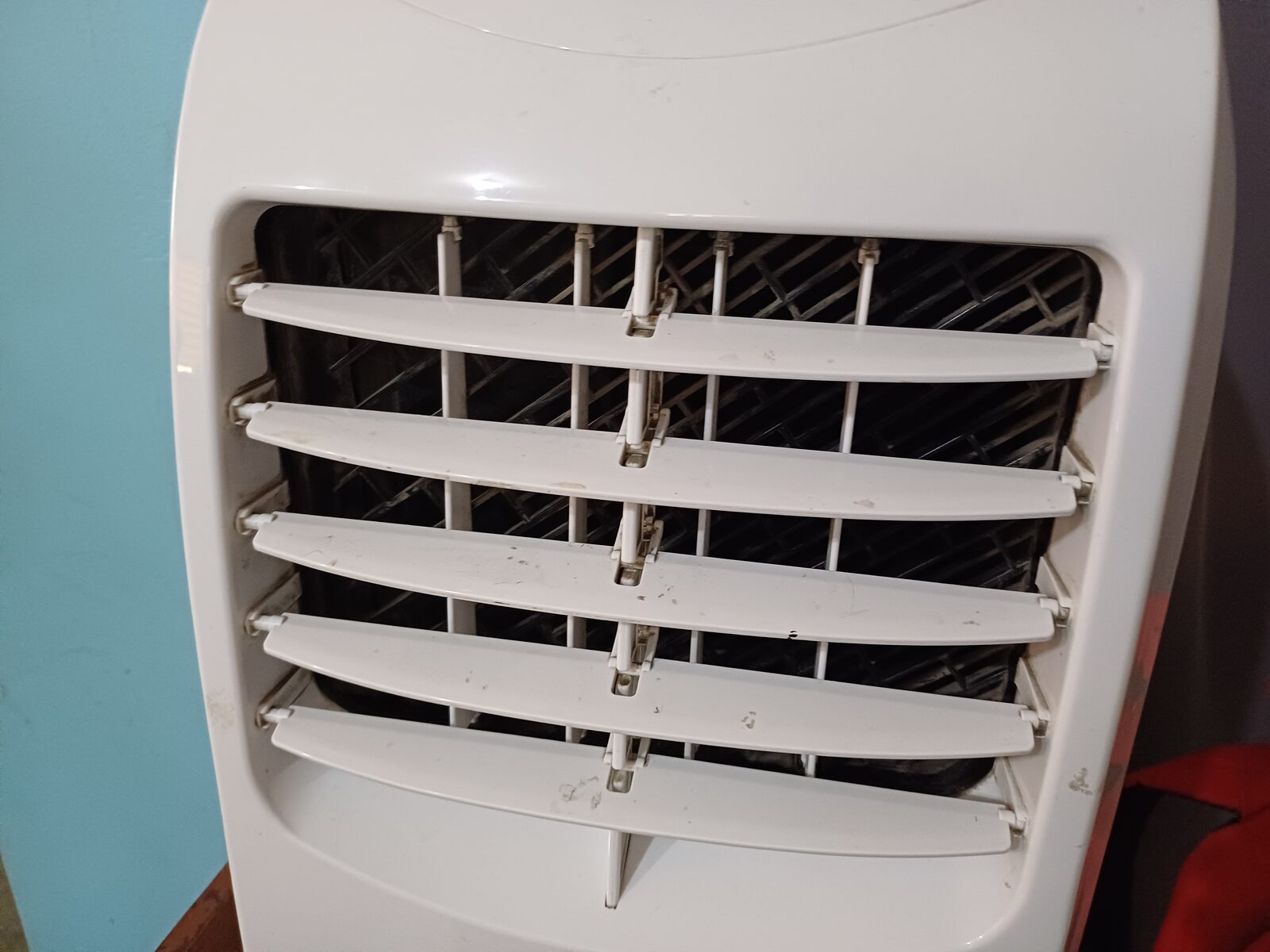 A portable air conditioner positioned indoors