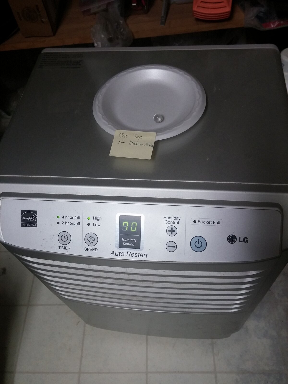 The top controls and air outlet of a real portable dehumidifier