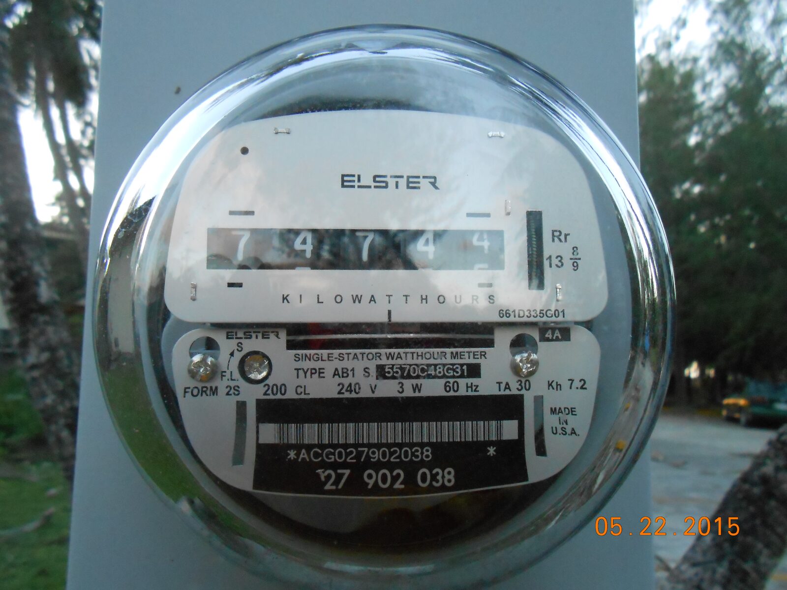 A residential analog electricity meter showing kilowatt-hour use