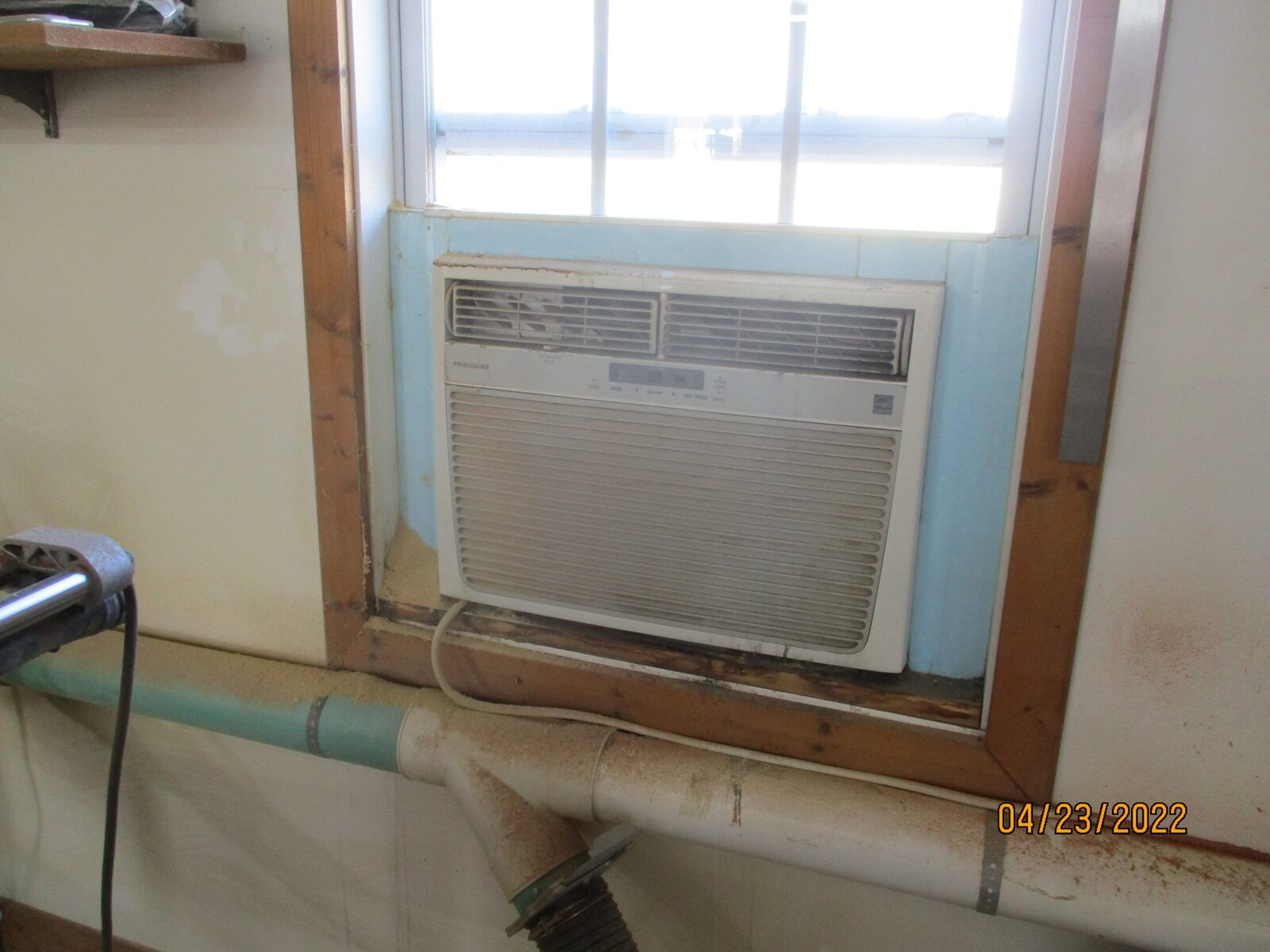 A window air conditioner installed in a residential window